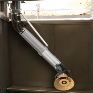 Telescoping fume extraction arm positioned over welding station in Texas workshop